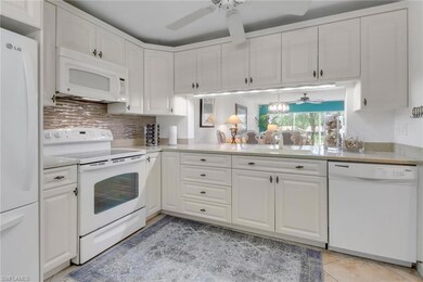 Dining space with baseboards and light tile patter