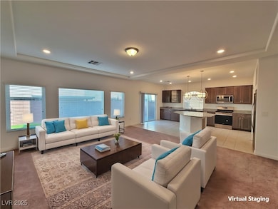 Living room featuring light carpet, plenty of natu