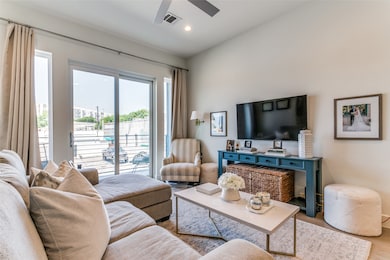 Living room with light hardwood / wood-style flooring and lofted ceiling