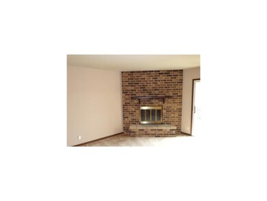 Living Room. Brick woodburning fireplace
