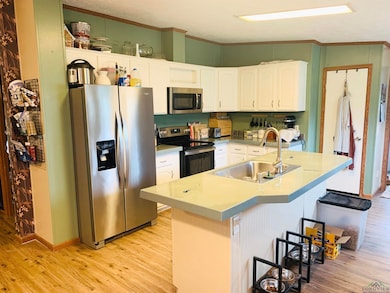Kitchen with appliances with stainless steel finis