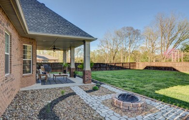 Gorgeous Landscaping with Pebble Rock & Stone Fireplace