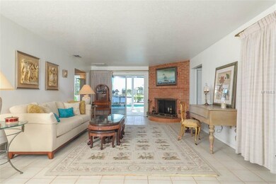 Living Room provides vista to pool & waterfront