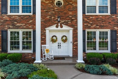 Stately columns adorn the entrance to this beauty 