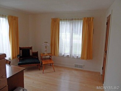 Bedroom w/light & hardwoods
