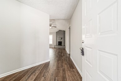 Formal entryway leads to the living room straight ahead, bedrooms to the right side, and dining area on the left.