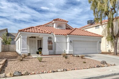 Mediterranean / spanish-style house with a garage,