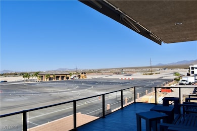 Balcony with race track and mountain views.