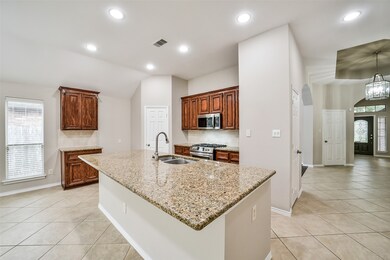 The open concept kitchen with granite countertops