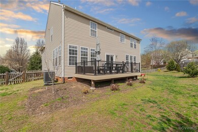 Rear view of house featuring a fenced backyard, cr