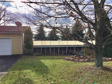 Above ground pool on side of house