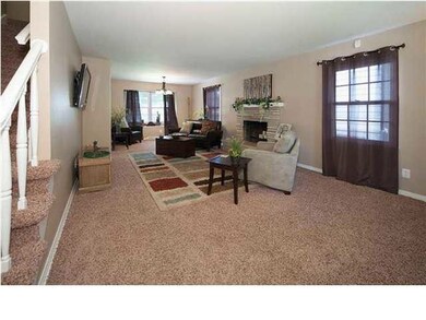 Spacious living room with woodburning fireplace