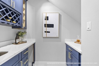 Just off the kitchen, your built-in bar with wine storage makes hosting feel seamless—you’re always ready to pour a glass and enjoy.