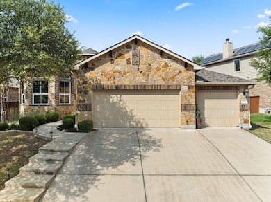 View of front facade featuring concrete driveway,
