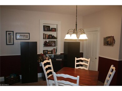 Dining room with closet and built in shelves.