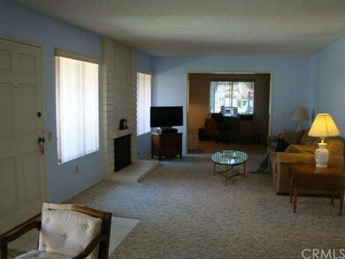 Spacious living room with fireplace with office/be