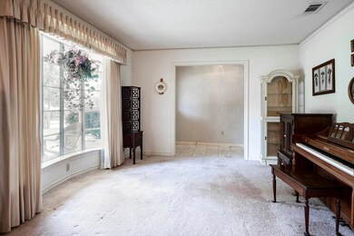Miscellaneous room featuring light colored carpet 