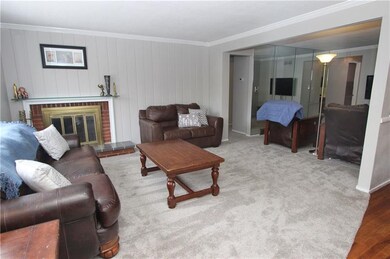 The living room expands and is currently used as a
