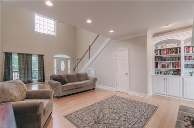 You will love the Open Areas of this home including the Large Living Room with Bamboo Hardwood Floors, Half Bath and easy access to the other rooms in the downstairs level.