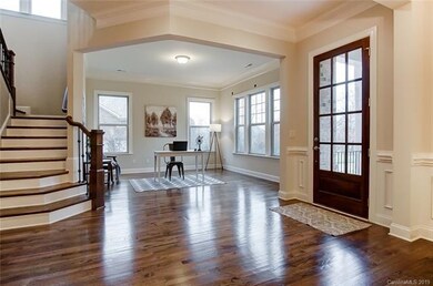Beautiful entry with wrought iron railing on oak t