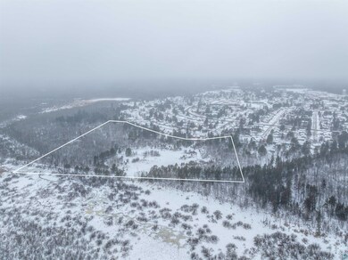 Snowy aerial view featuring a mountain view