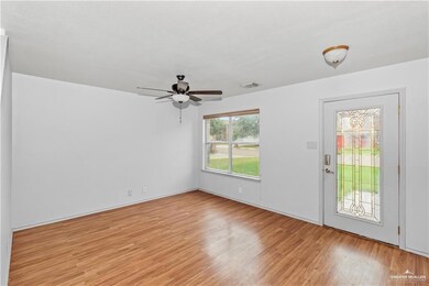 Unfurnished room with light wood-style floors and ceiling fan