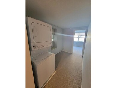 Stackable washer and dryer just out of the bedroom