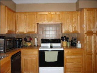 View of stove/oven and pantry on right. Eating spa