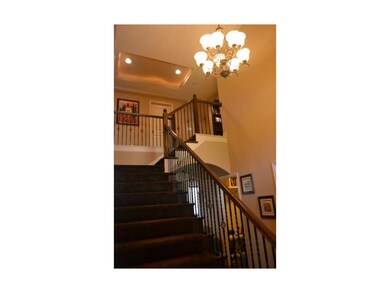 Lovely, two story entry with iron spindles and box