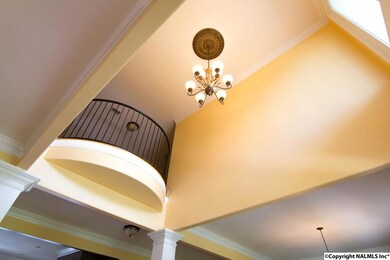 DOUBLE SOARING FOYER WILL LEAD YOUR GUEST TO A VERY OPEN LIVING AREA.