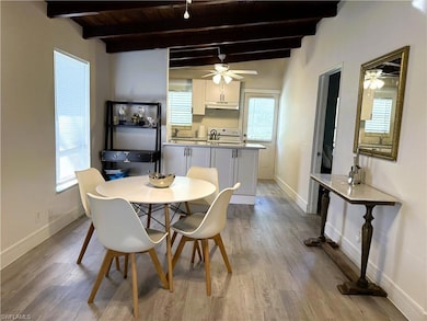 Dining room featuring wood ceiling, light hardwood