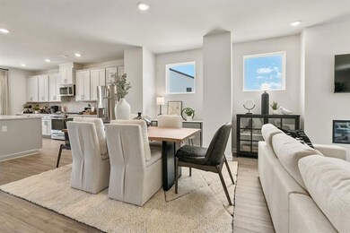 Dining room with recessed lighting and light wood-style flooring