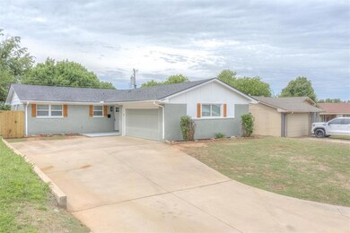 Single story home with a front lawn, brick siding,