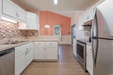 Kitchen with appliances with stainless steel finis