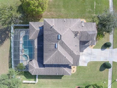Overhead drone view of the home shows the screen e