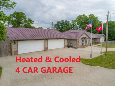 4 Car Garage- Heated and Cooled- Has it own water heater