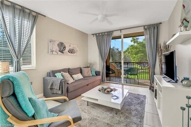 Living room featuring ceiling fan and light tile patterned flooring