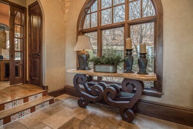Beautiful entry with custom travertine tiled groin