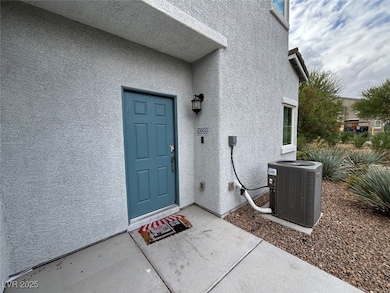 Doorway to property featuring stucco siding and a patio
