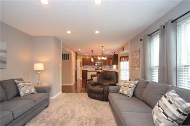 The family room offers new carpeting and opens int