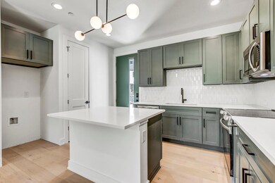 Kitchen featuring appliances with stainless steel