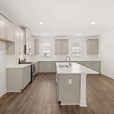 Kitchen featuring a sink, wood finished floors, a 