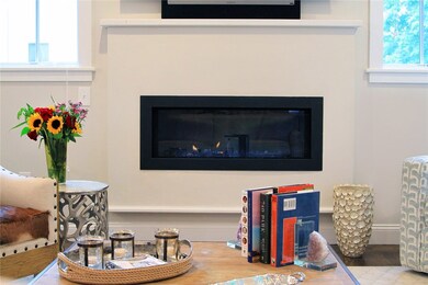 Beautiful gas fireplace is a focal point of the li