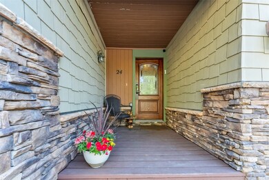 Property entrance with stone siding