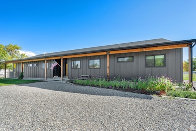 View of front of home featuring board and batten siding and covered porch