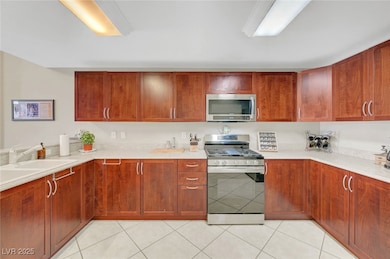 Kitchen featuring appliances with stainless steel