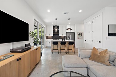Living area featuring finished concrete flooring 