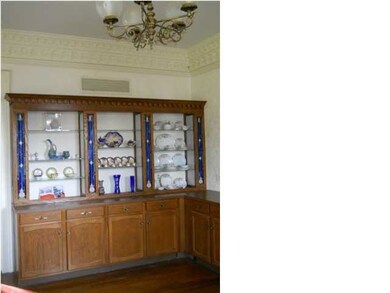 Intricate Crown Molding and Built-In Display Shelv