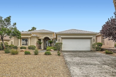 Manicured desert landscaping encompasses this home.


