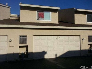 Back of house with 2 car garage